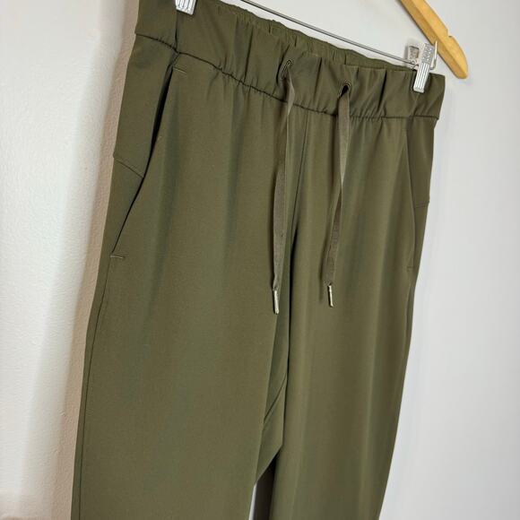 Lululemon On the Fly 7/8 Pant Drawstring Woven Dark Olive Women's 4 - Picture 3 of 11